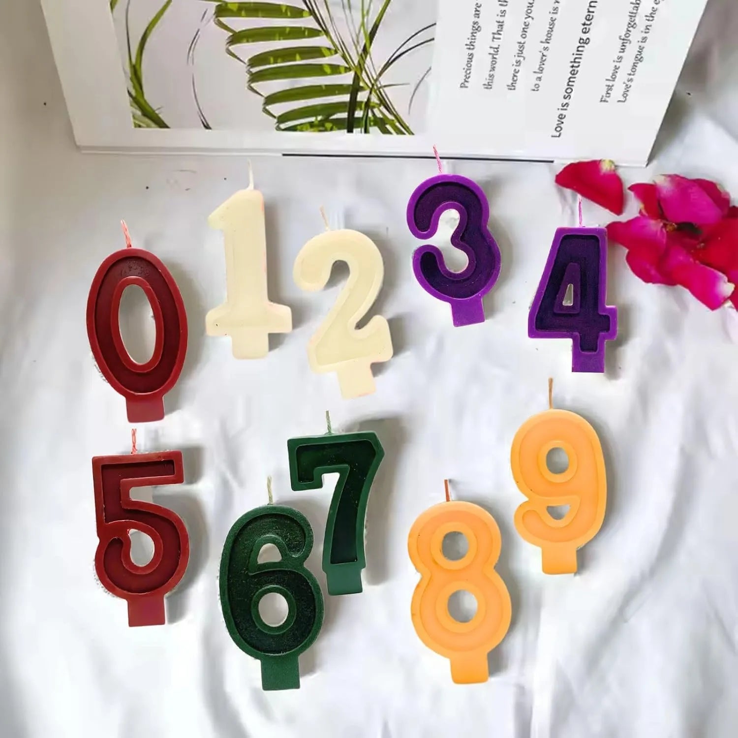 Colorful number candles from 0 to 9 arranged together for birthday decoration