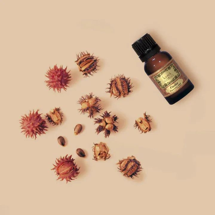Castor oil bottle placed with castor seeds arranged around it