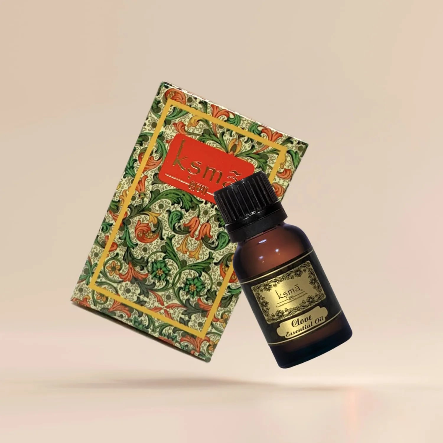 Clove essential oil bottle placed with decorative packaging box