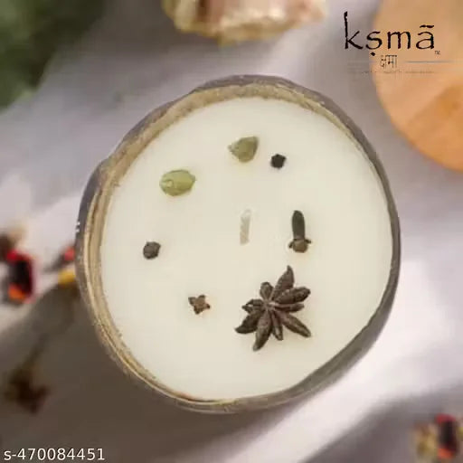 Hand holding coconut shell candle showing product size and design