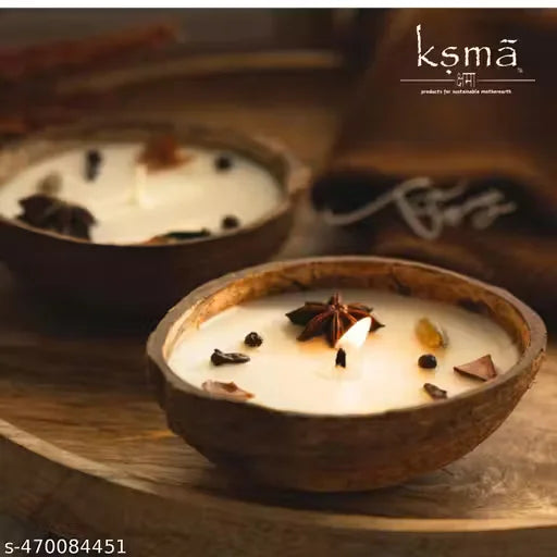 Coconut shell candle placed on wooden surface with warm lighting setup