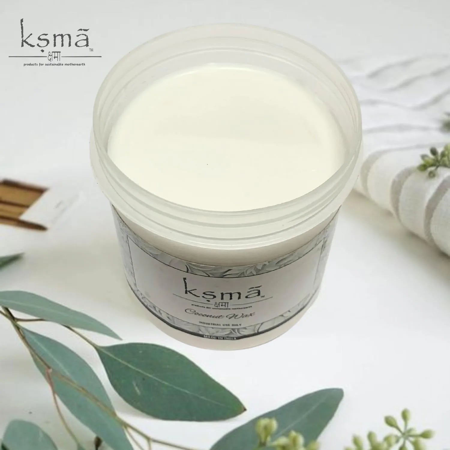 Top view of coconut wax in container used for candle making