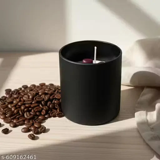 Coffee bean candle placed with roasted coffee beans in styled setup