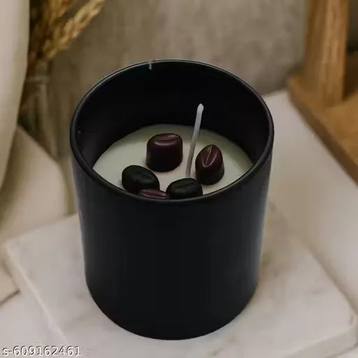 Coffee bean candle in black jar with coffee beans on top view display