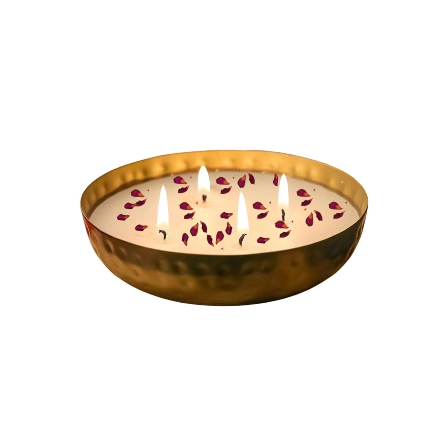 Top view of copper urli bowl candle with four wicks and floral wax detailing