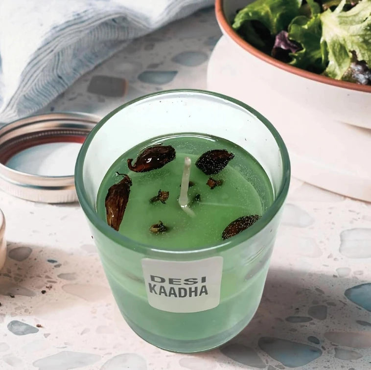 Top view of desi kaadha sea green candle with spice decoration