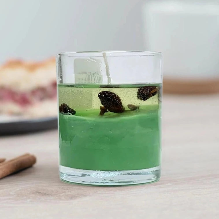 Desi kaadha sea green glass candle with herbal spice decoration