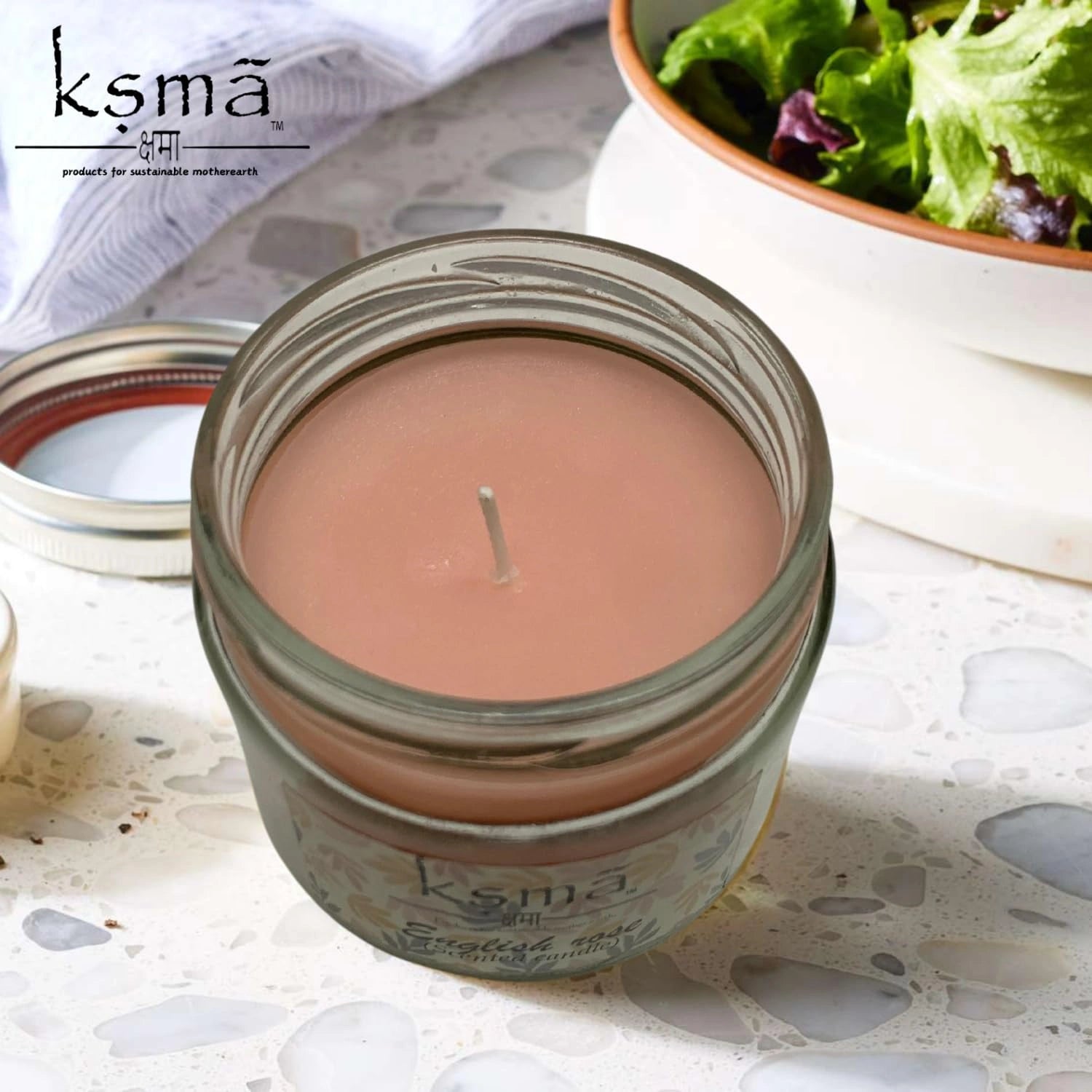 Angled view of english rose jar candle highlighting wax texture and elegant design