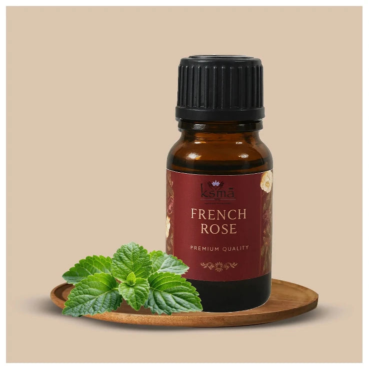French rose fragrance oil bottle product display with mint leaf setup