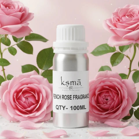 French rose fragrance oil bottle surrounded by blooming pink roses