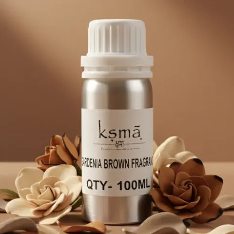Gardenia brown amber fragrance oil bottle placed with decorative flowers on warm background