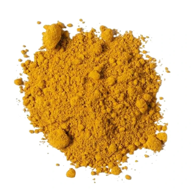 Loose gold pigment powder pile used for candle color mixing and wax projects