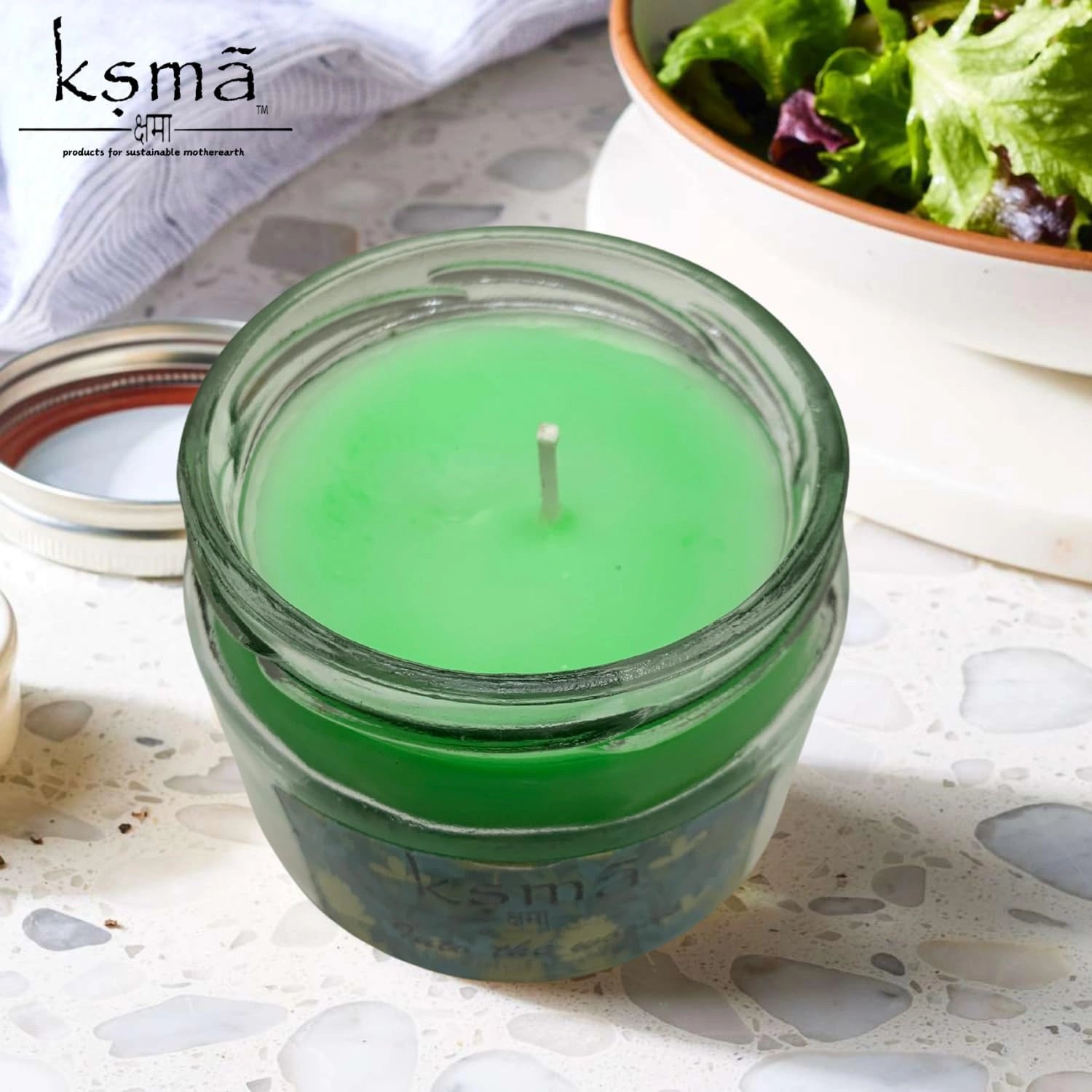 Top view of green jar candle showing smooth wax surface for decorative and aromatic use