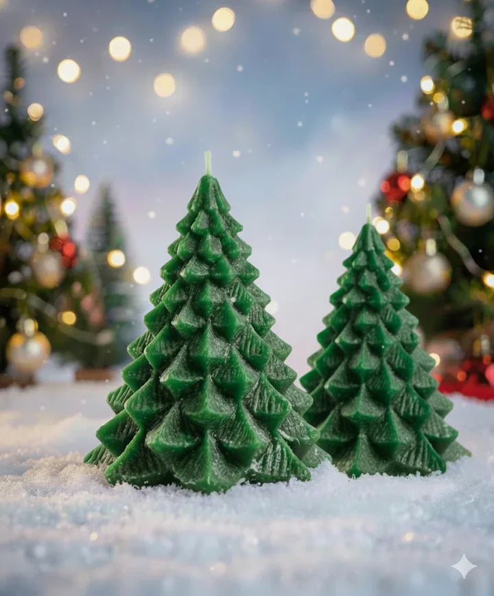 Green Christmas tree candles placed in winter themed setup with snow effect