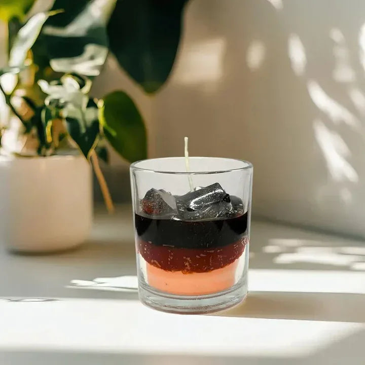glass jar candle iced mocha design placed in cozy home decor setting
