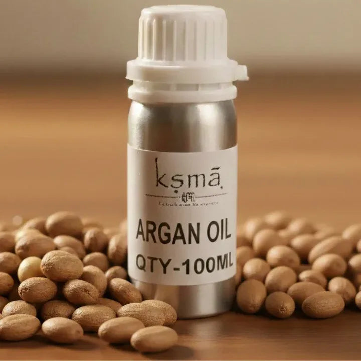 KSMA argan oil bottle placed with argan kernels