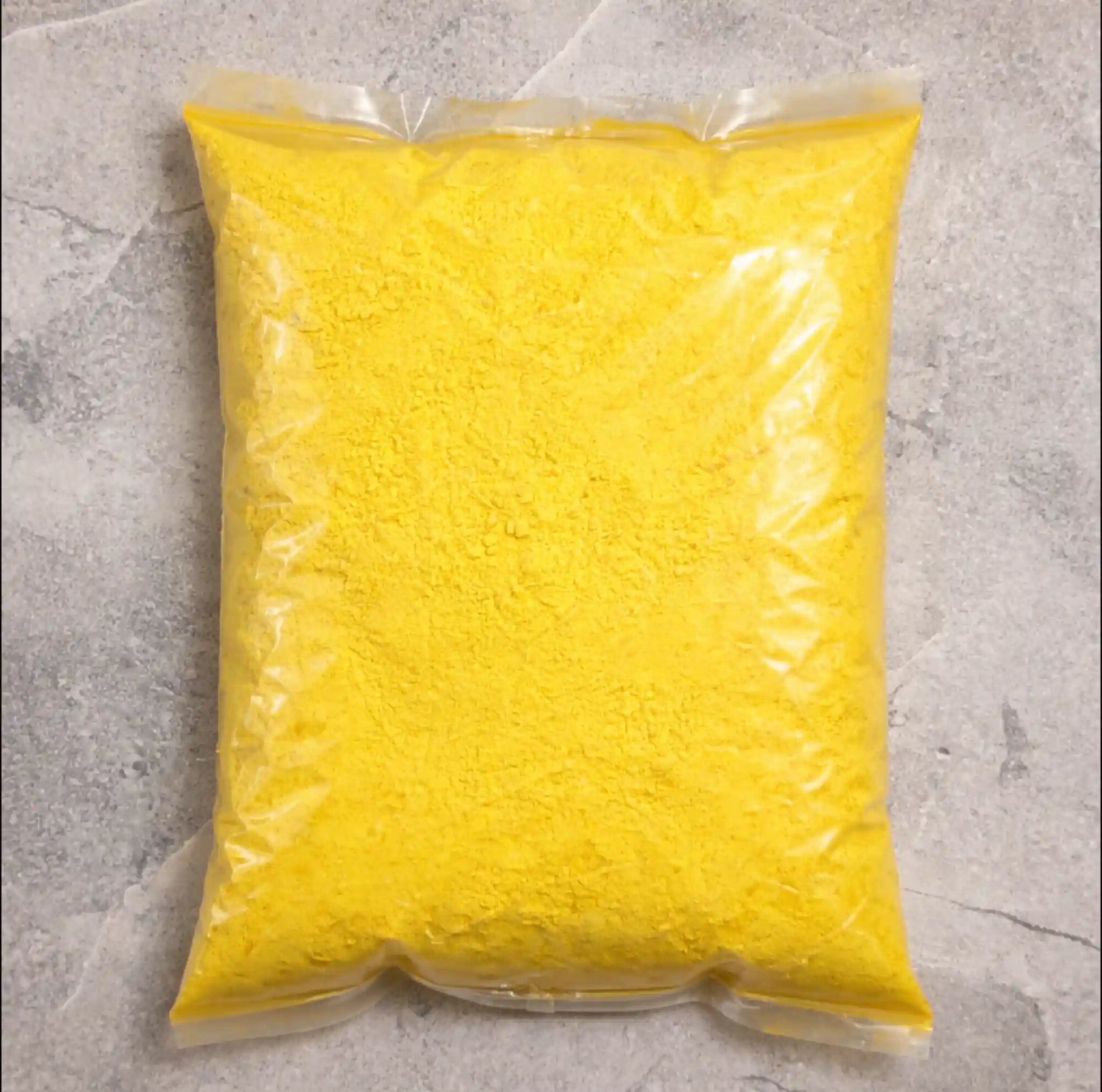 Light yellow pigment powder spread displaying soft color for candle making use