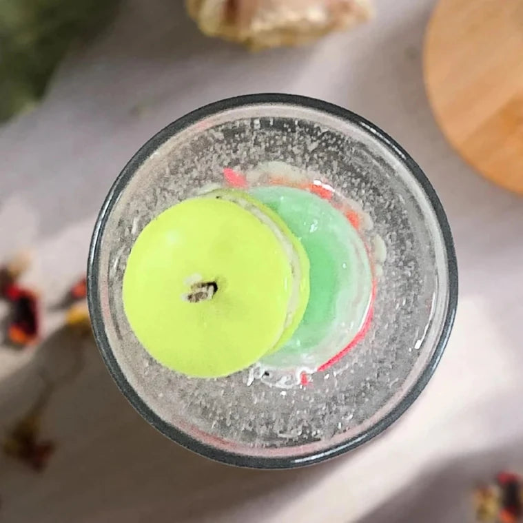 Top view of macaroon fragrance layered glass candle