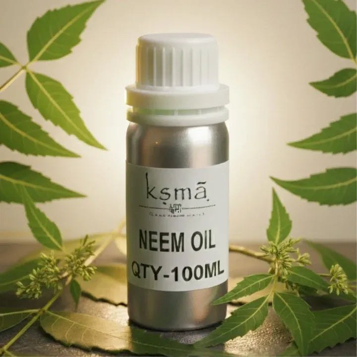 Neem oil in white bottle placed with green leaves background