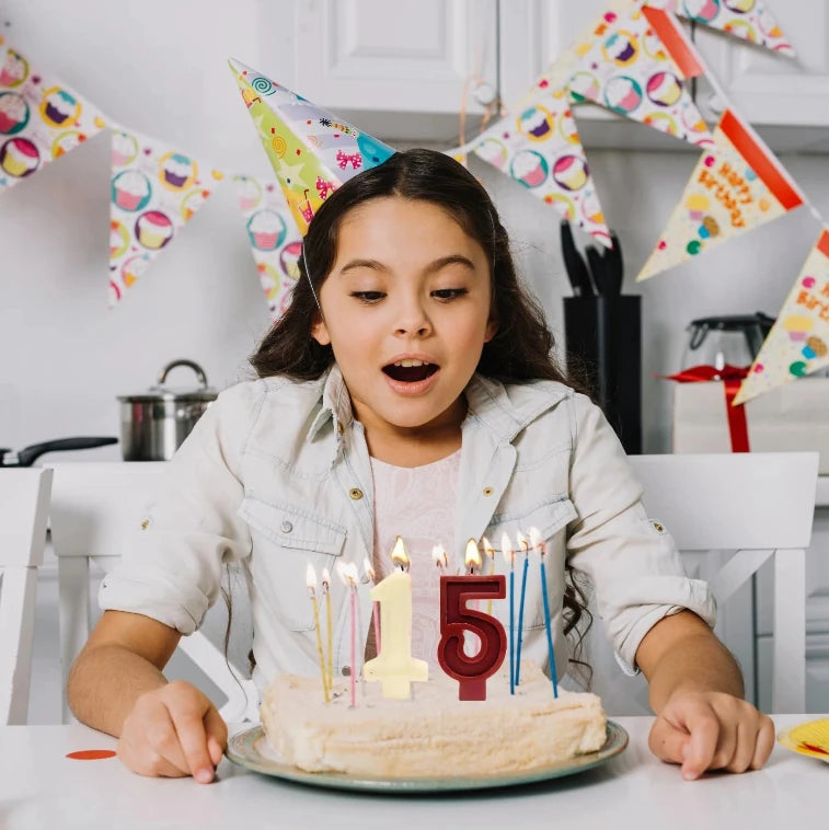 Number 9 birthday candle used on cake during birthday celebration