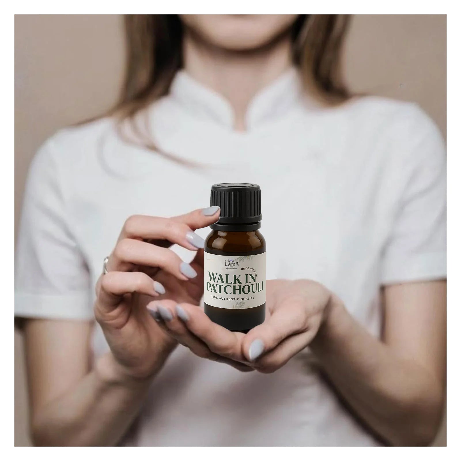 Person holding patchouli fragrance oil bottle showing real use and product size