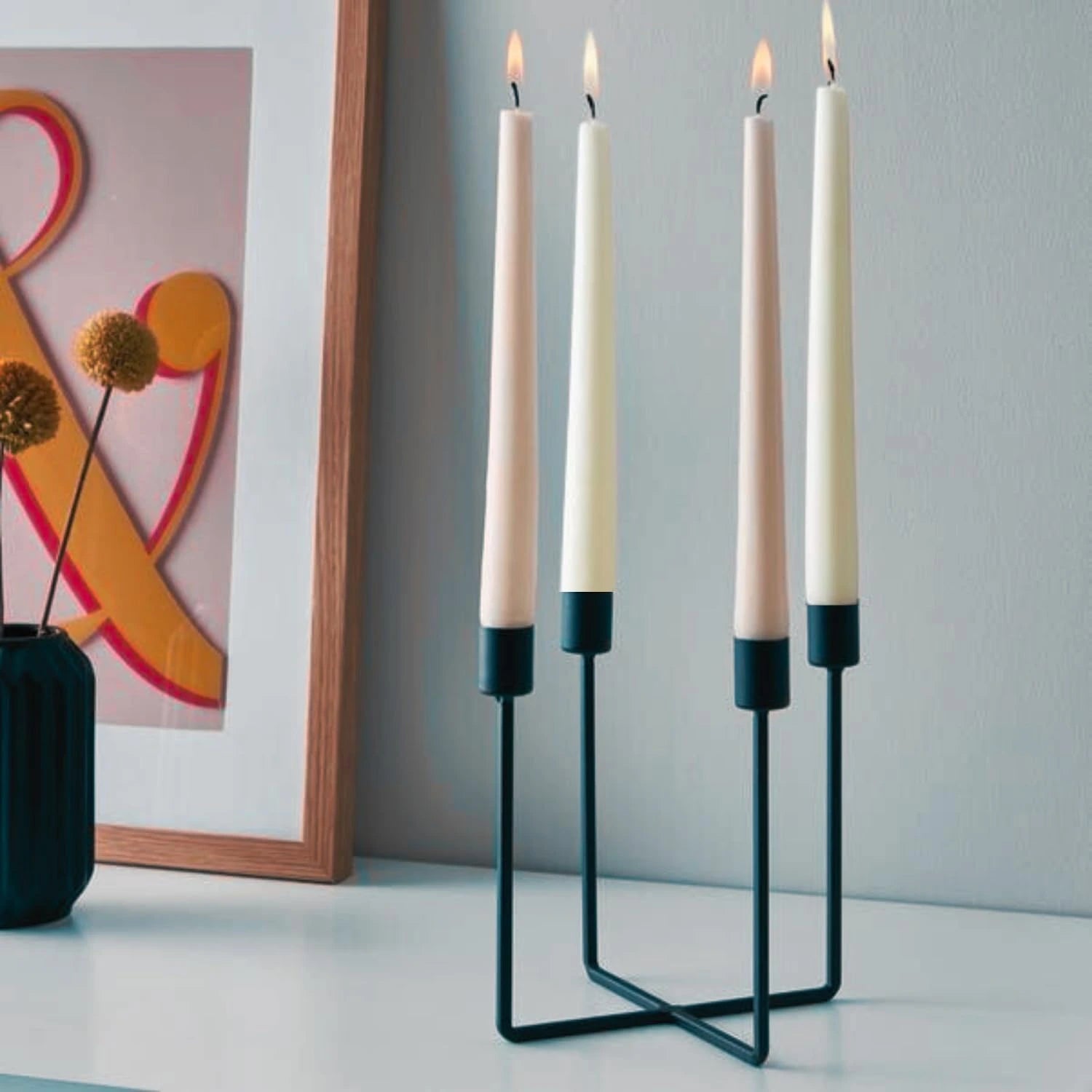 Pillar candles displayed in a modern black stand for stylish home decoration