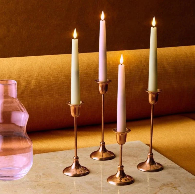 Pillar candles arranged on table for decoration
