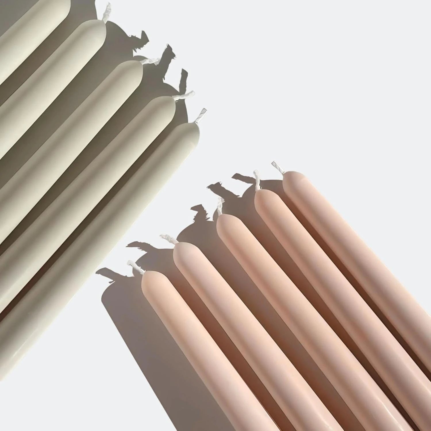 Vanilla amber pillar candles set arranged in an angled stack showing smooth finish