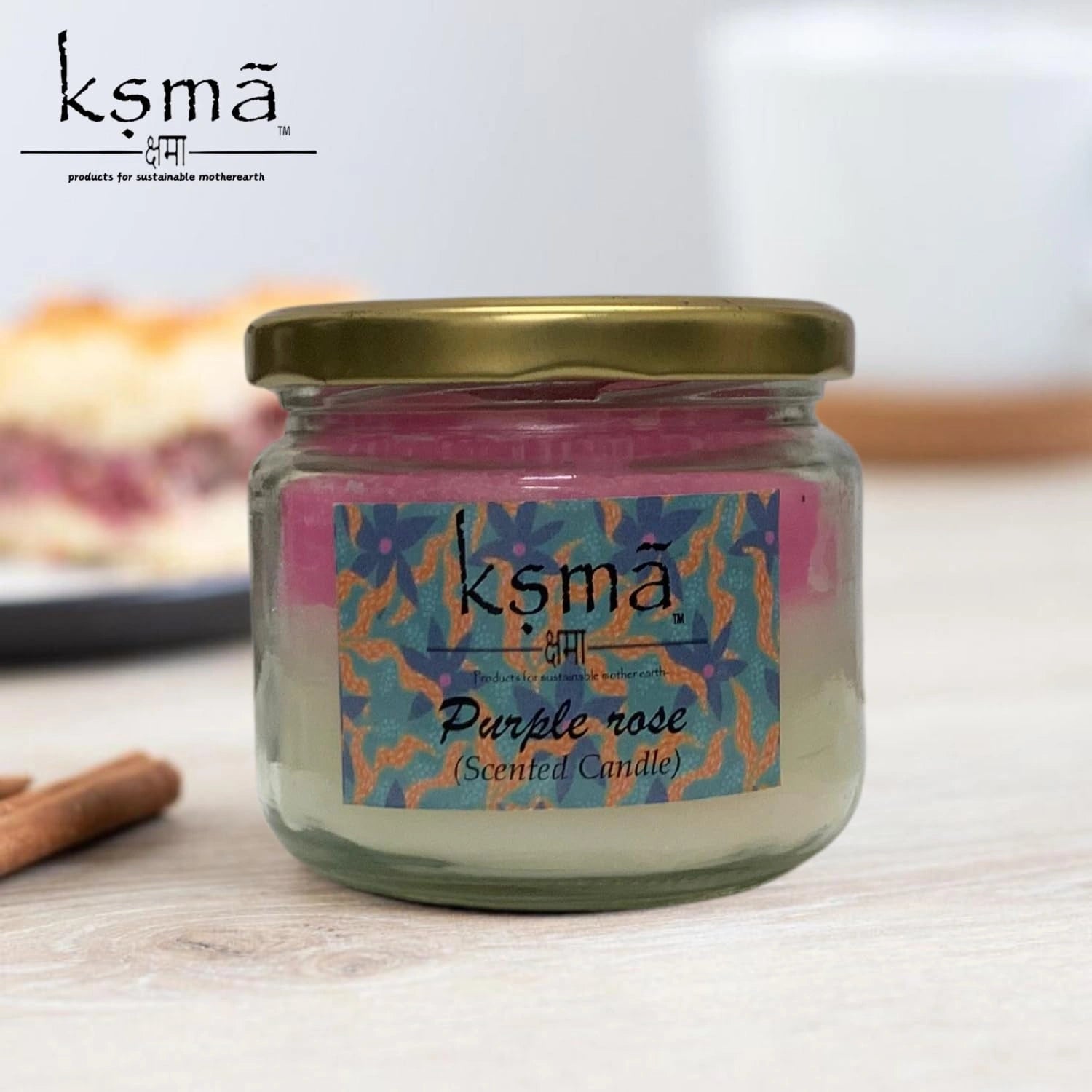 Purple rose jar candle placed in decorative setup for home ambiance and festive lighting