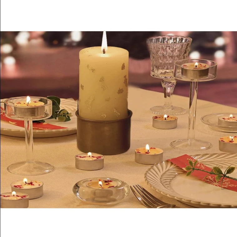 Close up of rose scented tealight candle glowing with soft ambient light