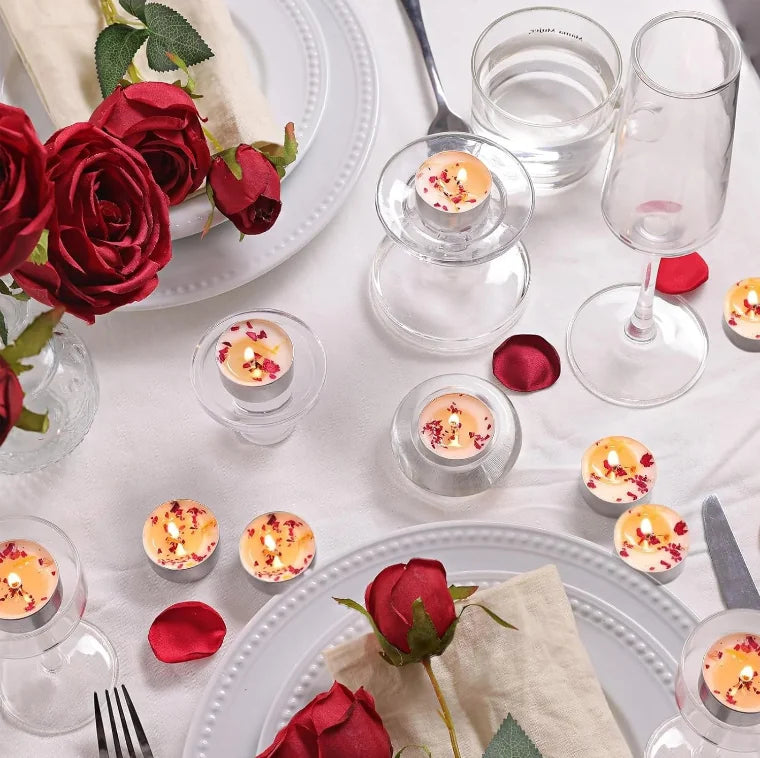 Rose tealight candles arranged in floating decorative setup with petals and soft lighting