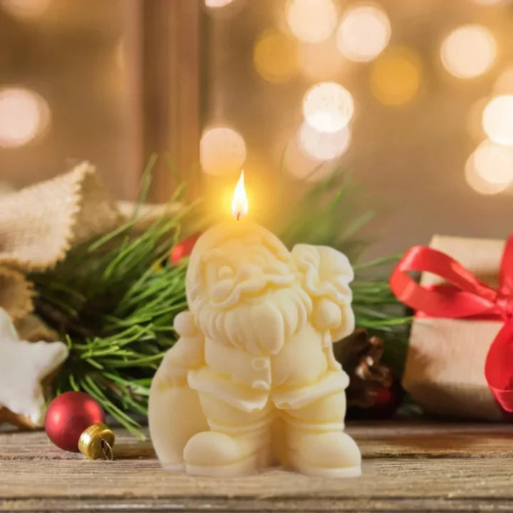 Santa Claus bag candle placed in Christmas decoration setup with lights and ornaments