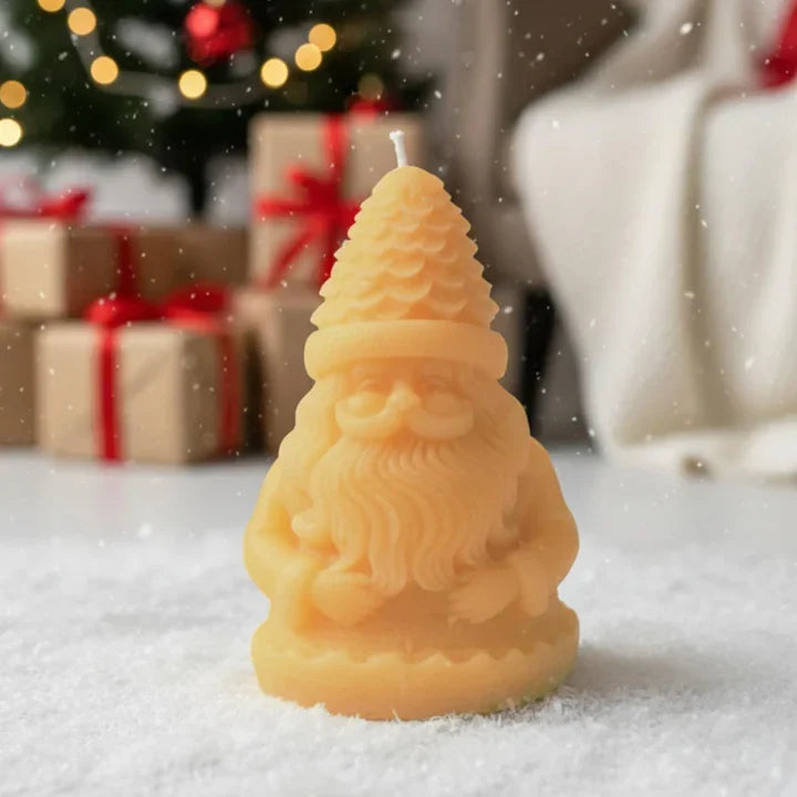 Santa Claus shaped decorative candle with coco vanilla fragrance front view on white surface