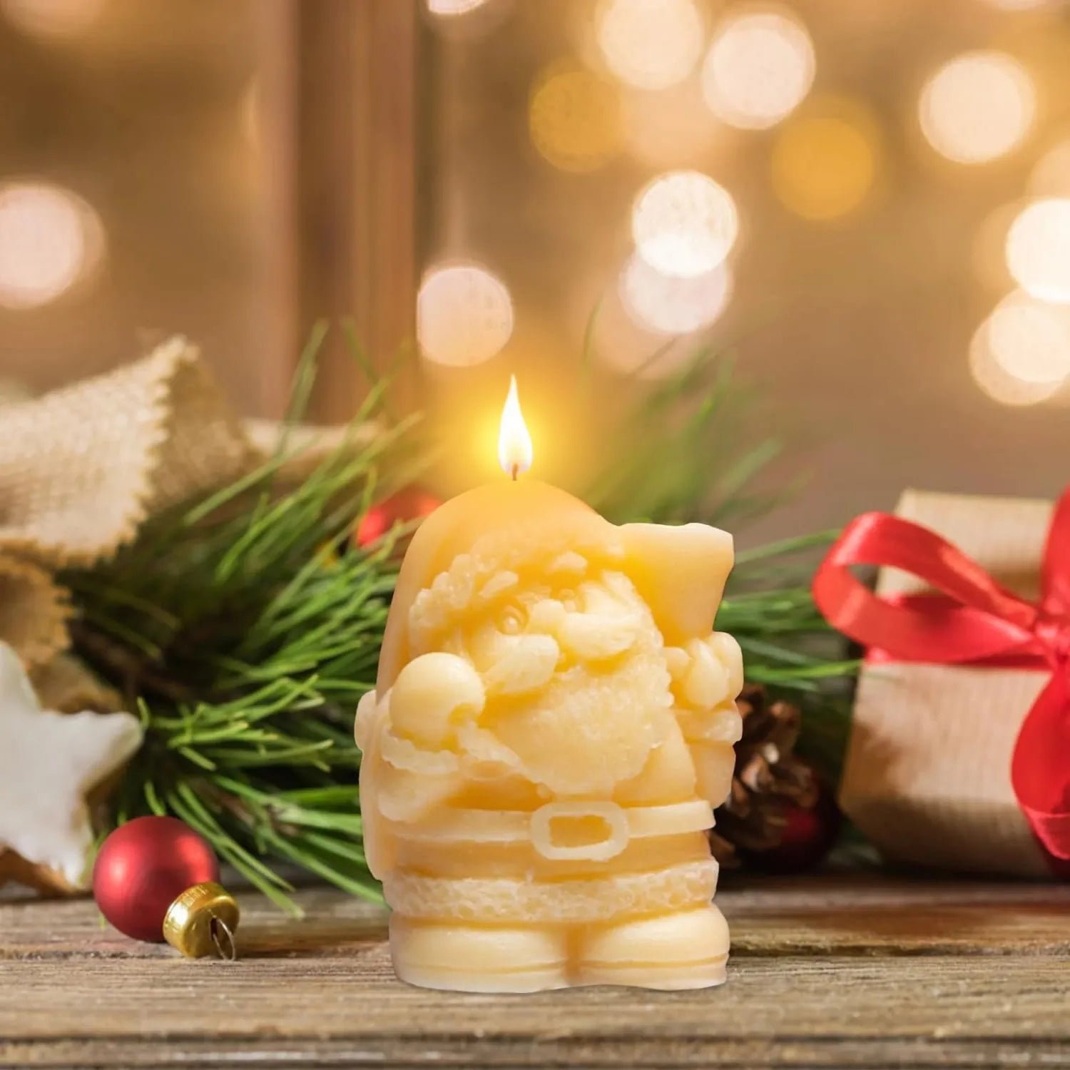 Small Santa Claus candles placed in Christmas decor setup with lights and ornaments