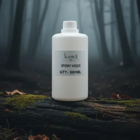 Spooky wood fragrance oil arranged in misty forest style setup with dark tones
