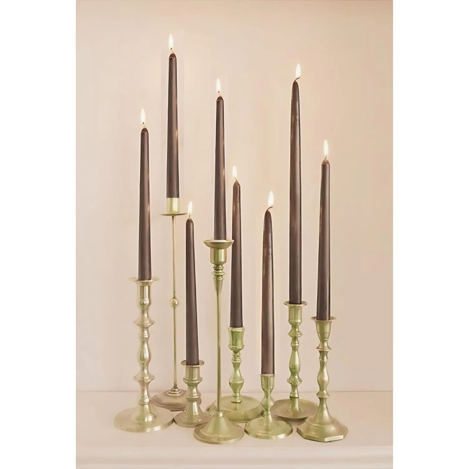 Set of tall pillar candles arranged in a modern minimal indoor setting