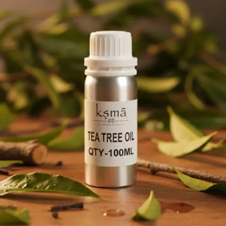  Tea tree essential oil bottle placed with green leaves in natural setting