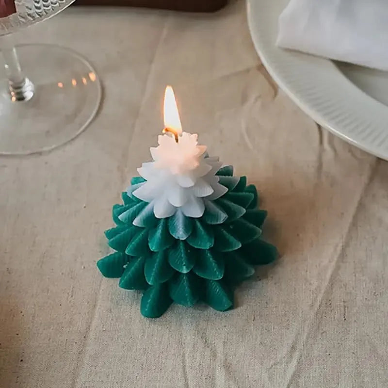 Tree shaped candle glowing warmly in a cozy indoor festive setup