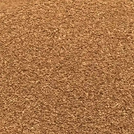 Close up texture of walnut shell grit abrasive particles